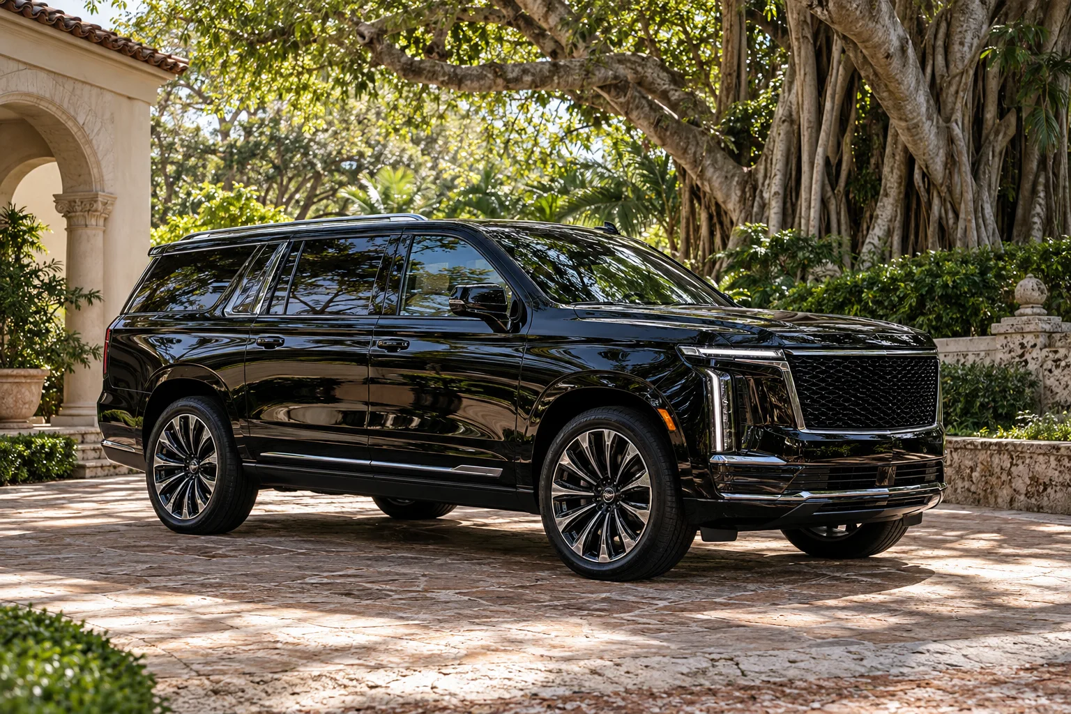 Illustrative black SUV on a landscaped South Florida driveway; not a Wara customer job